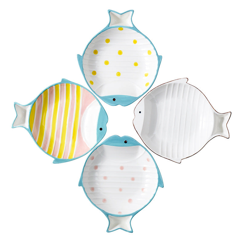 All four color variants of the fish-shaped ceramic cat bowl: yellow polka dot, pink-yellow stripes, brown border, and pink polka dot